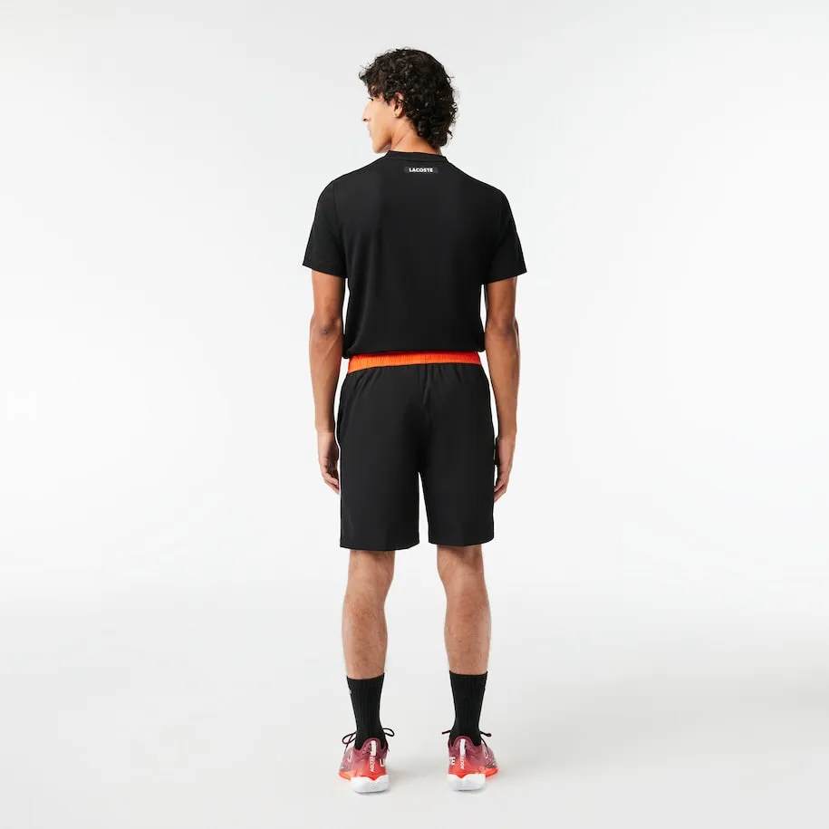 Herren Stretch Tennis Shorts Schwarz / Orange Patagonia Kleidung